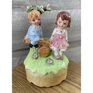 Lefton Vintage Music Box Boy And Girl Sitting On A Log, Outdoors